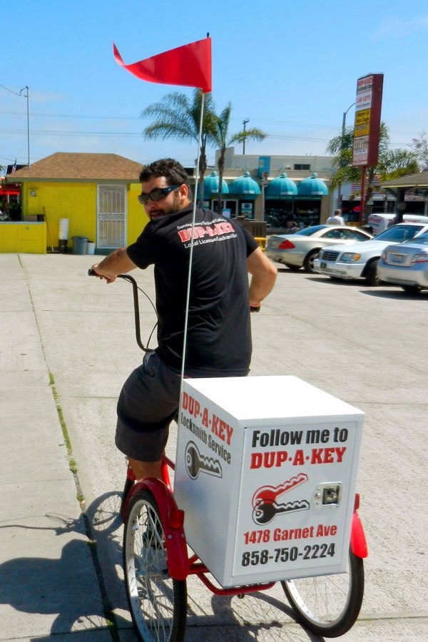 Wes riding the DUP-A-KEY tricycle cart in Pacific Beach